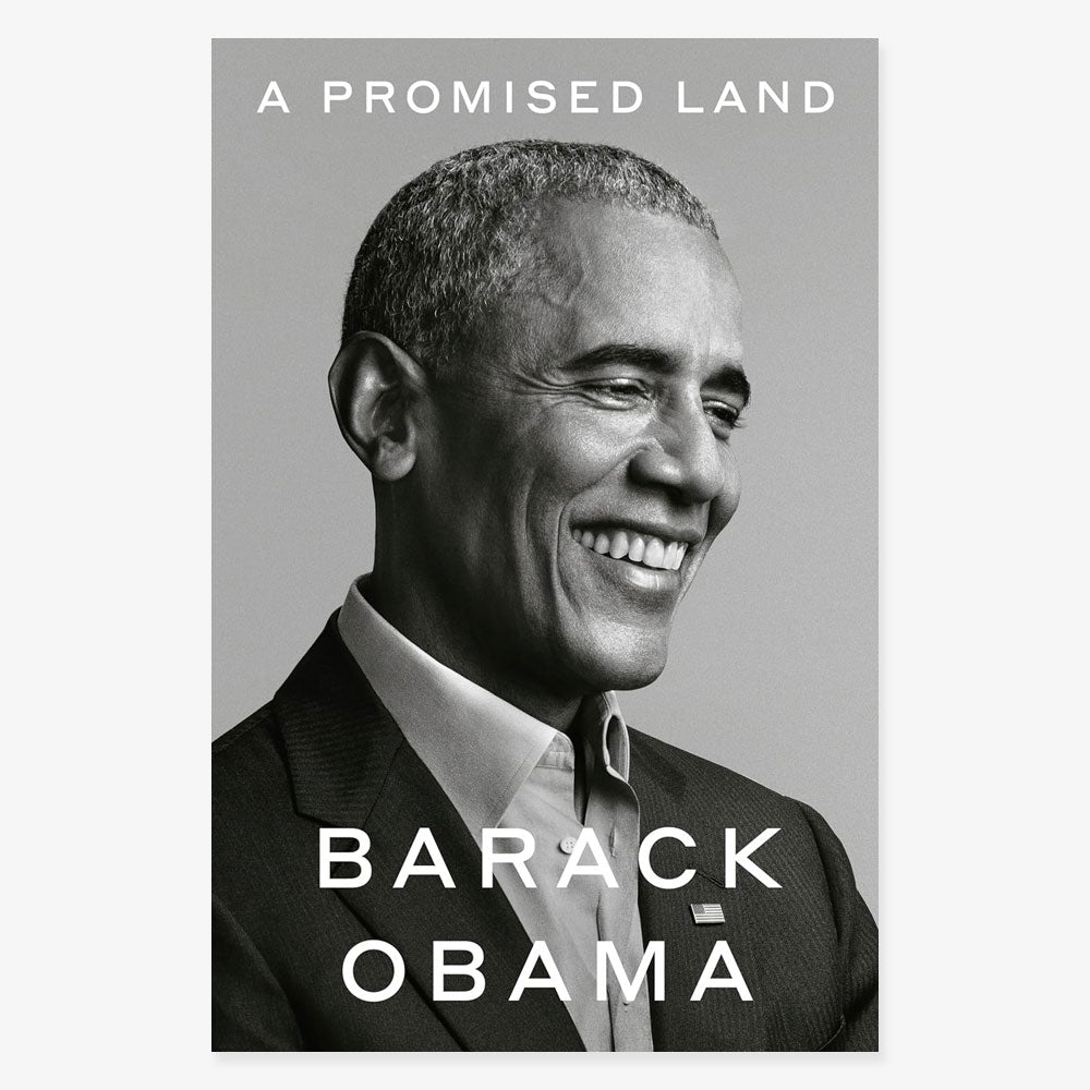 Black-and-white photo of Barack Obama smiling in a suit and tie. The title "A Promised Land" appears at the top, with his name in large letters below.