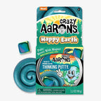 A package of Happy Earth Putty, a sensory toy with teal magnetic putty and a rainbow magnet. The box shows a smiling Earth image and product info, with a warning: not suitable for children under 3 years old.