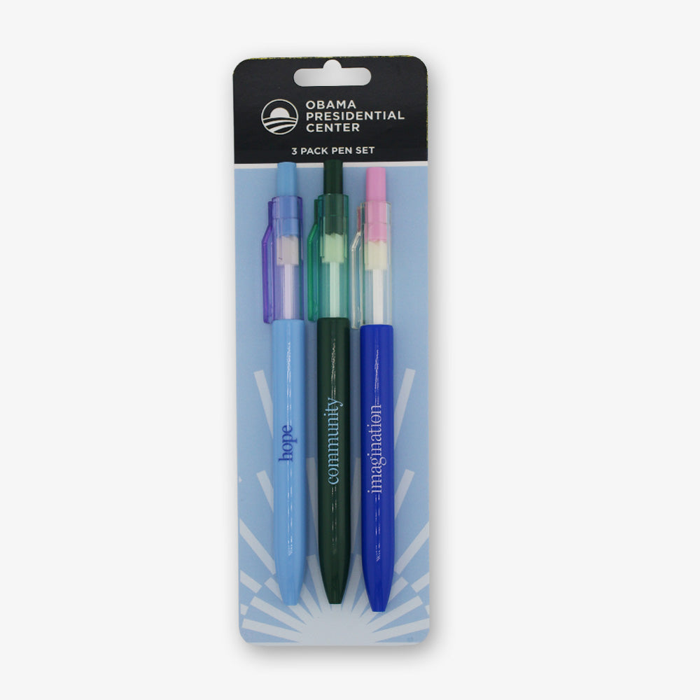 The Obama Presidential Center Pen Set includes three pens in blue, green, and dark blue, each with “hope,” “community,” or “imagination” printed on them and a matching colored clip.