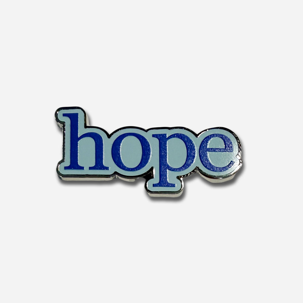 A magnet featuring the word "hope" in bold blue letters outlined in white, set against a light background—a meaningful keepsake from the Obama Presidential Center and perfect for pairing with a matching hope pin.