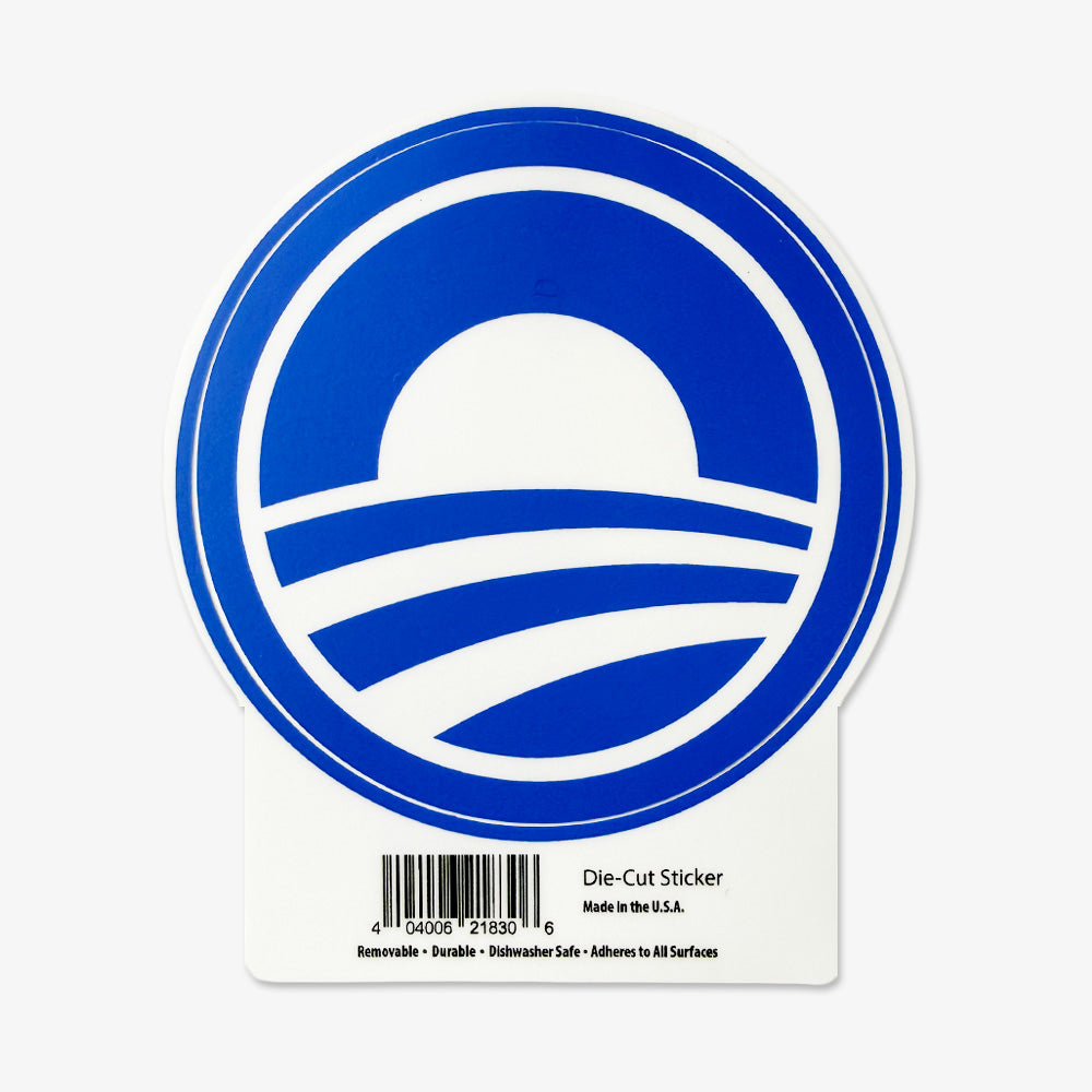 The Obama Presidential Center Symbol Sticker is a round blue sticker showing a white sun over three curved stripes, inspired by Chicago’s South Side. It comes on a white backing with a barcode and product details.