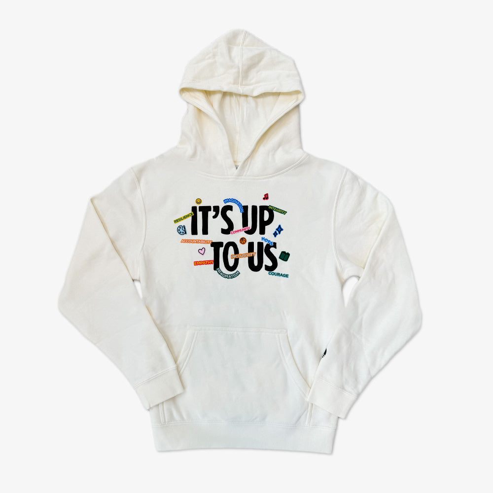 The Obama Presidential Center Stickers Youth Hooded Sweater features “ITS UP TO US” in bold on the front, decorated with vibrant flag and symbol designs around and inside the text.