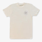 The Obama Presidential Center Hope to Action T-Shirt in Ivory features a small circular logo and emblem on the upper left chest, displayed flat on a white background.