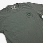 The Obama Presidential Center Hope to Action T-shirt is a gray tee featuring the circular center logo on the left chest, laid flat to display the front design and collar with visible tag.