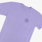 The Obama Presidential Center Hope to Action T-shirt is a lavender short-sleeve shirt with a small circular “O” logo on the left chest, displayed flat against a white background.