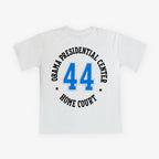 Show your support with the Obama Presidential Center Home Court T-shirt, featuring a bold blue 44 on the back, circled by black text that reads "Obama Presidential Center Home Court," inspired by the Obama Foundation’s spirit.