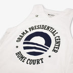 The Obama Presidential Center Home Court Jersey is a white basketball jersey by Champion, featuring “Obama Presidential Center Home Court” in black around a sun-and-waves logo.