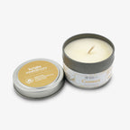 A small tin holds a white, hand-poured Connect Sprig Candle 4 oz. The lid, set beside it, displays “bright endeavors” and “Obama Presidential Center” for the Obama Foundation. The label reads Connect 4oz soy candle.