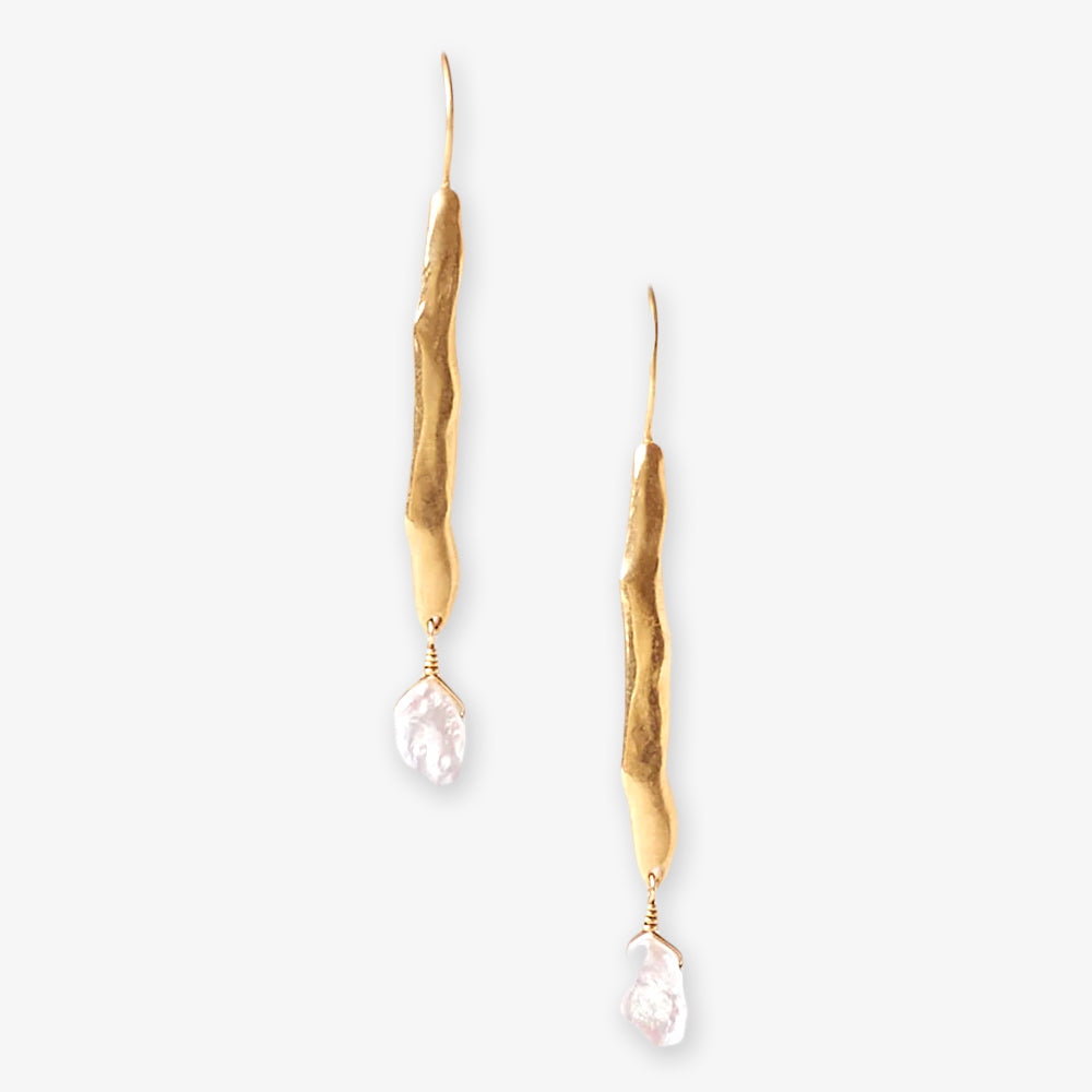The Gold Wave Pearl Drop Earrings feature an organic wavy design in 18k gold plated sterling silver with a single irregular white pearl, showcasing elegant, sustainable artisan craftsmanship.