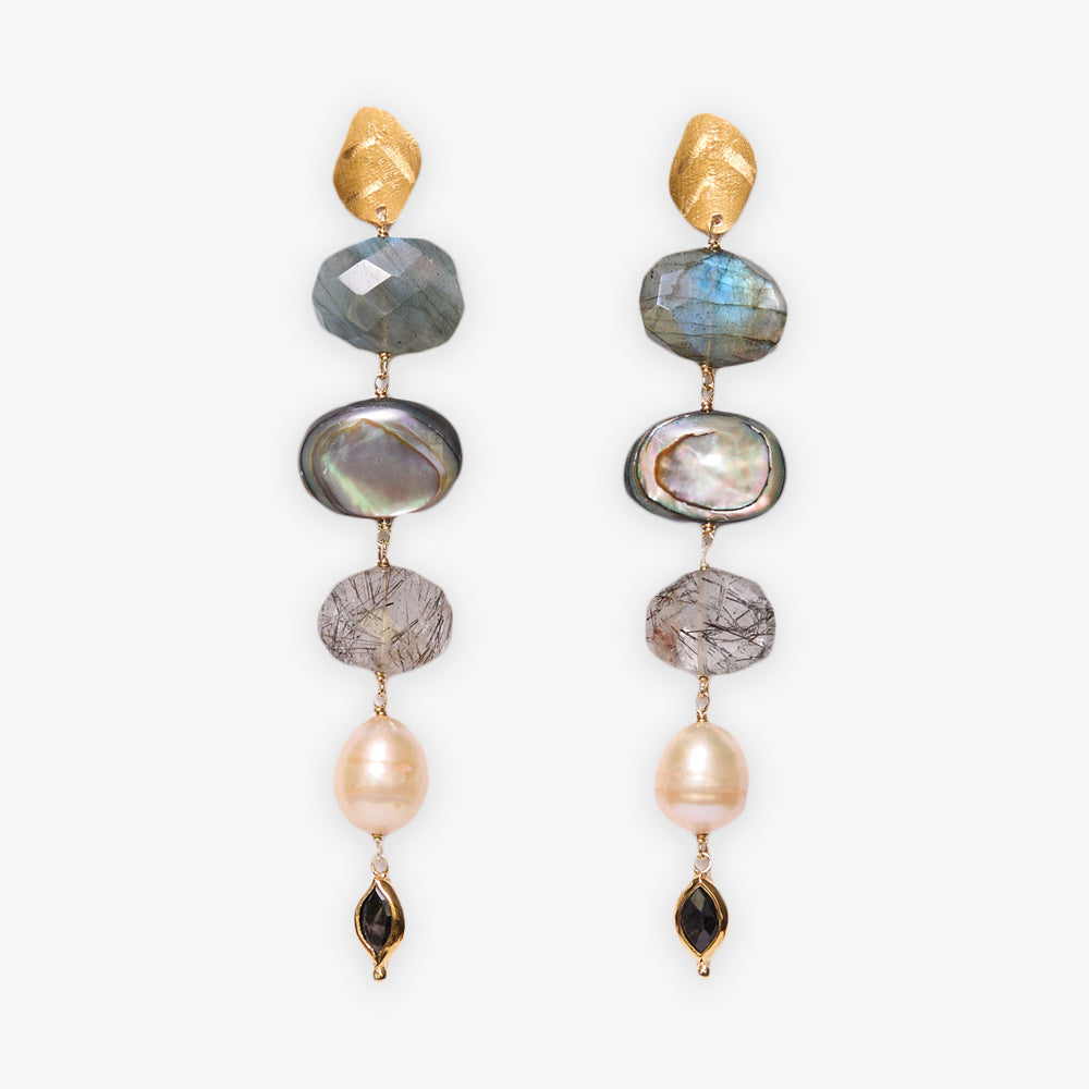 Discover the Gemstone Mix Cascade Drop Earrings—elegant, sustainable artisan jewelry featuring gold leaf-shaped studs, stacked blue, gray, and pearl stones, and a teardrop-shaped black stone for a stunning statement.