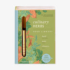The Culinary Herbs Seed Library by Modern Sprout is a book-shaped kit with organic herb seeds, charming illustrations, and a gold dibber—everything you need to start your own herb garden.