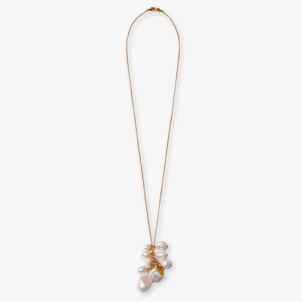The White Pearl Necklace features a gold chain adorned with a cluster of irregular freshwater pearls and an elegant gold fish charm as its pendant.