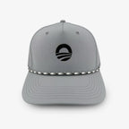 A gray Obama Presidential Center Golf Cap featuring a black circular logo on the front and a black-and-white braided rope across the brim.