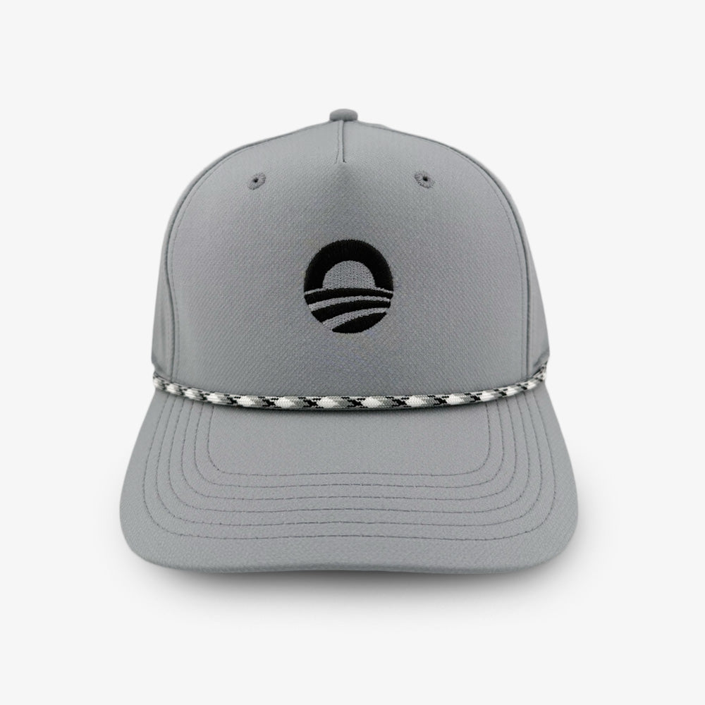 A gray Obama Presidential Center Golf Cap featuring a black circular logo on the front and a black-and-white braided rope across the brim.