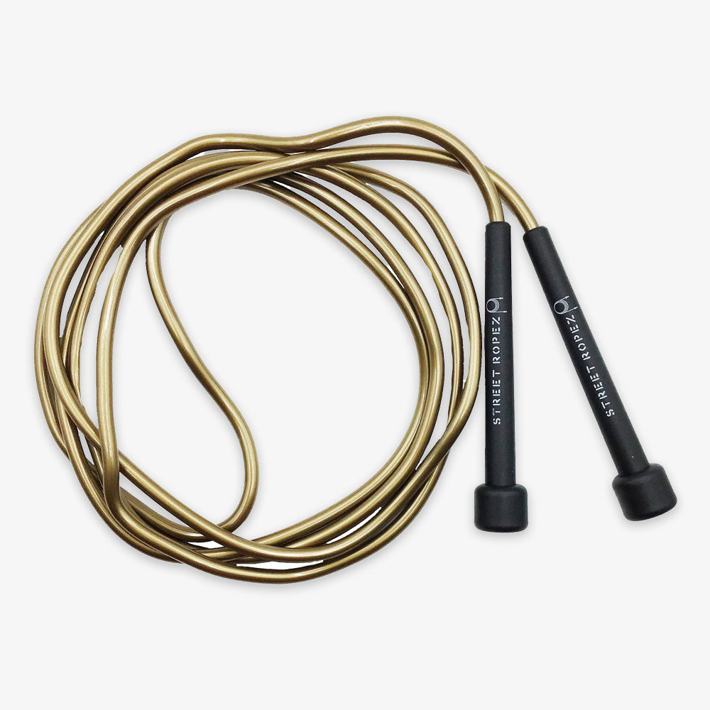 An Adult Jump Rope with black handles labeled STREET ROPEZ lies on a white background, loosely coiled to showcase its flexible design and smooth texture—an ideal fitness accessory for any workout.