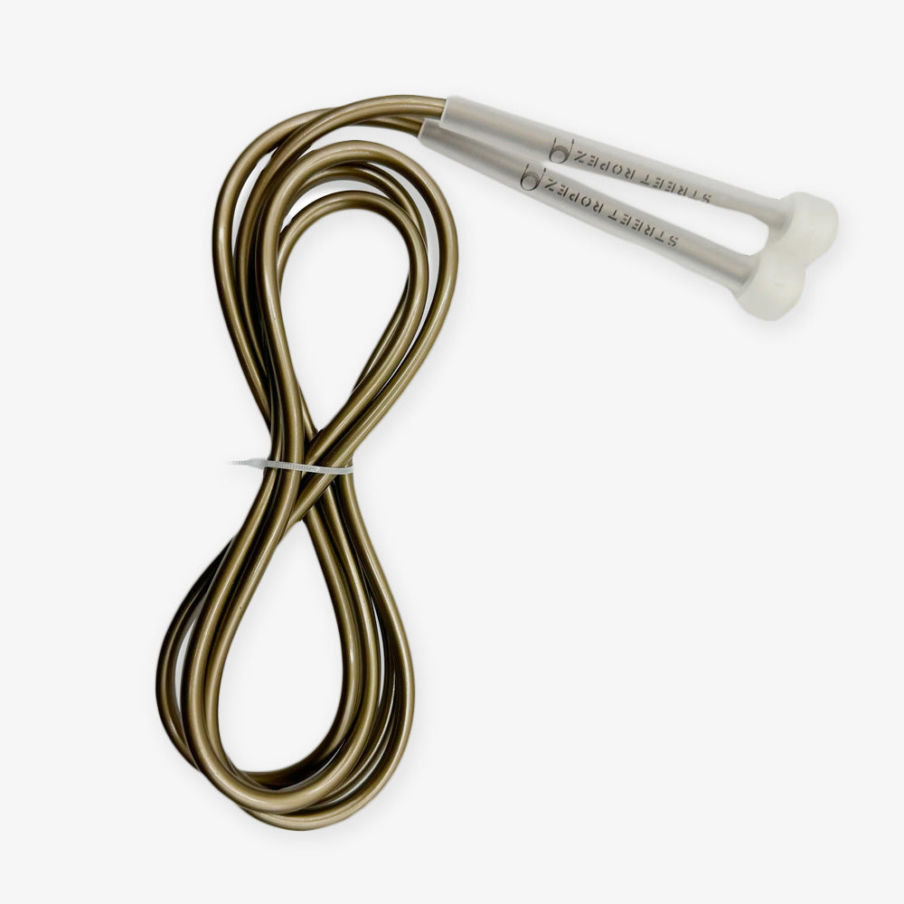 The Kids Jump Rope features a gold-colored, adjustable rope with white handles, neatly coiled and secured with a twist tie on a white background. Ideal for fun and fitness activities for children.