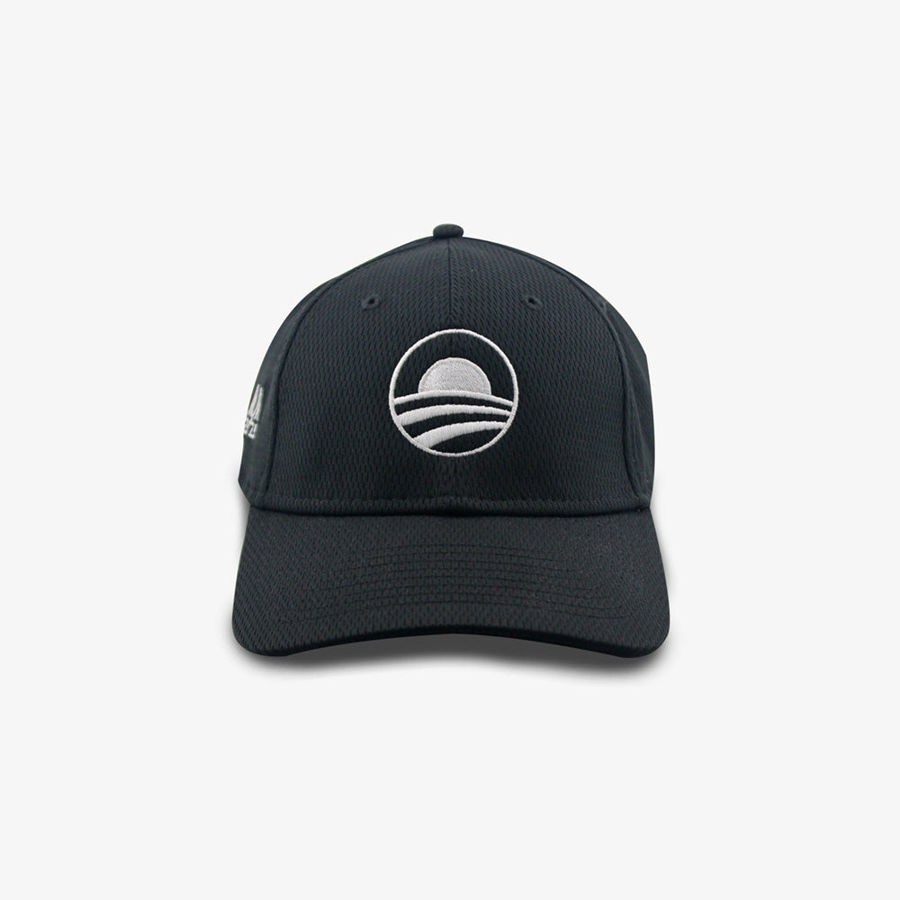 The Obama Presidential Center New Era Symbol Cap is a black baseball cap featuring a white embroidered rising sun logo over three curved lines, with a curved brim and visible stitching—perfect for fans of the Center's iconic style.
