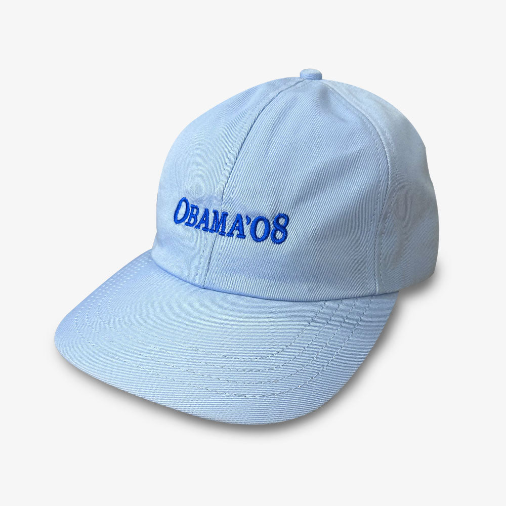 The Official Obama 2008 Campaign Hat in light blue features "OBAMA 08" embroidered on the front, celebrating Barack Obama's 2008 run. Ideal for campaign memorabilia collectors, it's displayed against a white background.