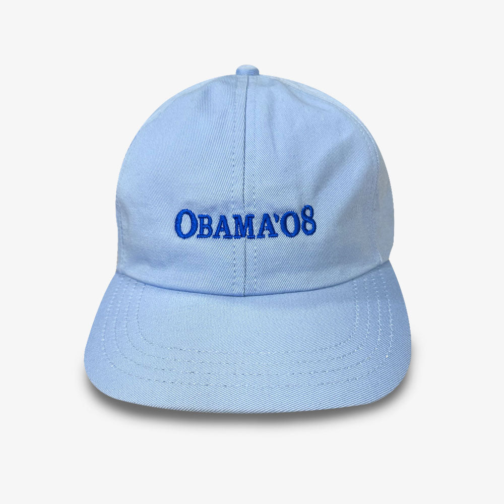 The Official Obama 2008 Campaign Hat in light blue features "OBAMA 08" embroidered on the front and is displayed against a white background—ideal memorabilia for any supporter.