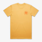 The Obama Presidential Center Hope to Action T-shirt - Sunset is a plain yellow tee with a small orange circular logo and text on the left chest, laid flat on a white background. Simple yet inspirational apparel.
