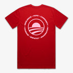 The Obama Presidential Center Hope to Action T-shirt - Sunset is a red tee with a large white circle logo on the back featuring a stylized sunset and waves, along with inspiring words: RESILIENCE • HOPE • COMMUNITY • COURAGE • EMPATHY • IMAGINATION.