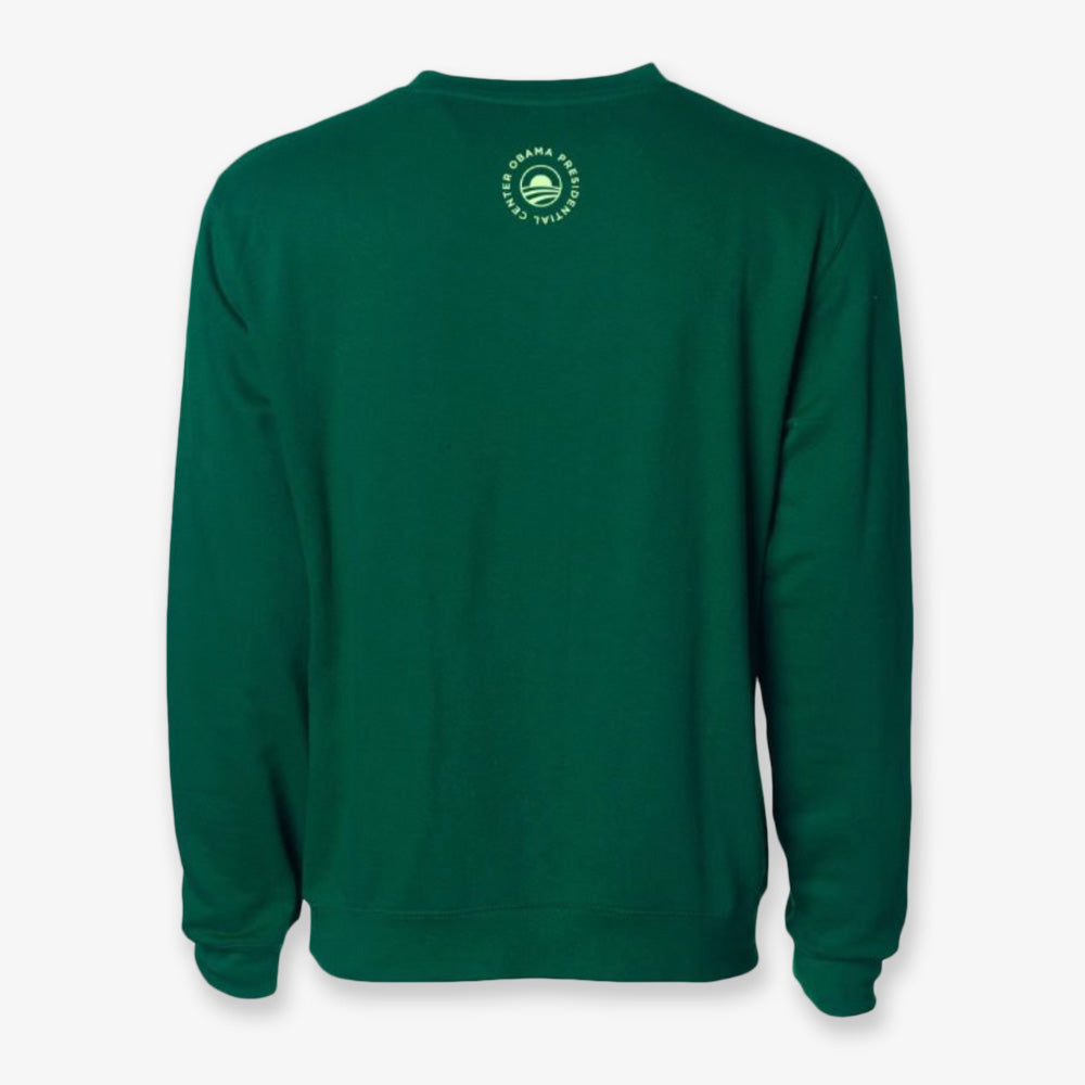 The Obama Presidential Center Hope Sweatshirt in green is shown from the back, featuring a small circular light green logo with text near the top center below the neckline.