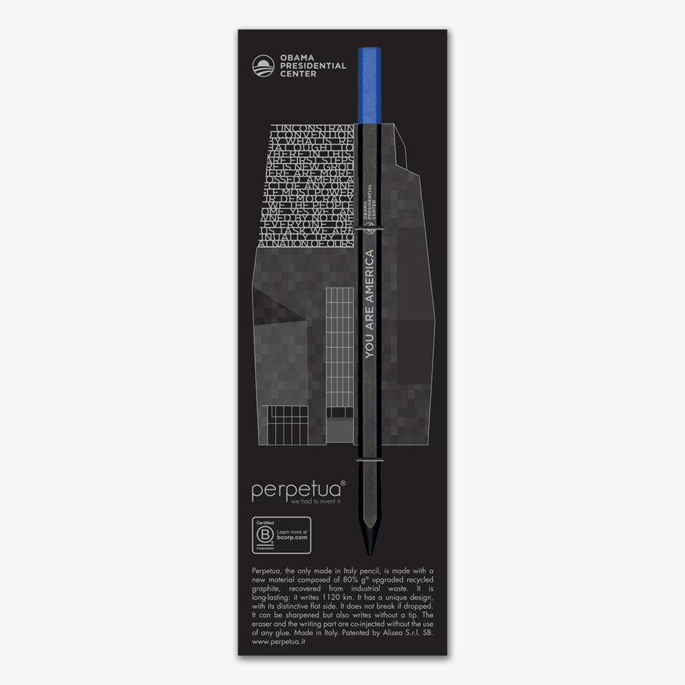 The Obama Presidential Center "You are America" Perpetua Pencil is a black woodless pencil with blue eraser, displayed on packaging featuring a grayscale illustration of the center, the Perpetua logo, and "recycled graphite pencils" description.
