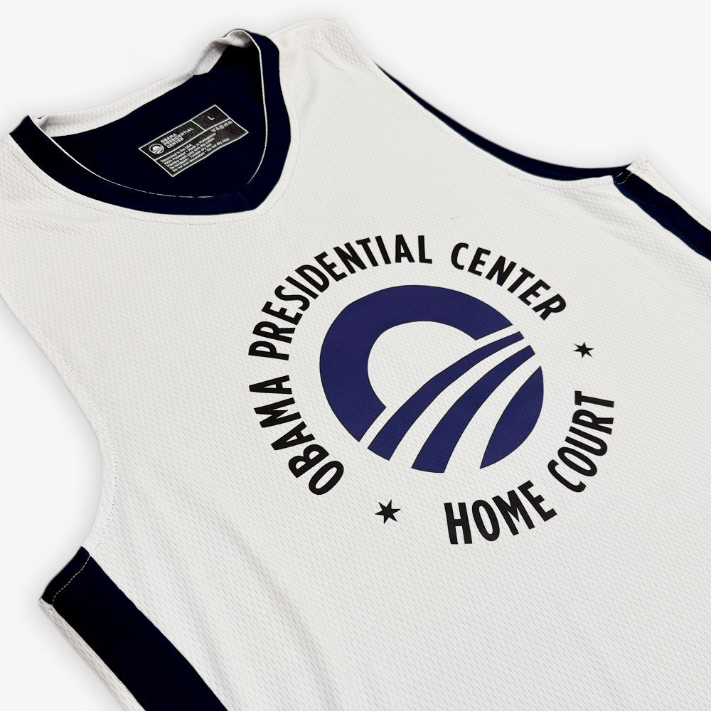 The Obama Presidential Center Home Court Jersey - White features navy trim and a circular "Obama Presidential Center Home Court" logo on the front; part of the exclusive Home Court collection.