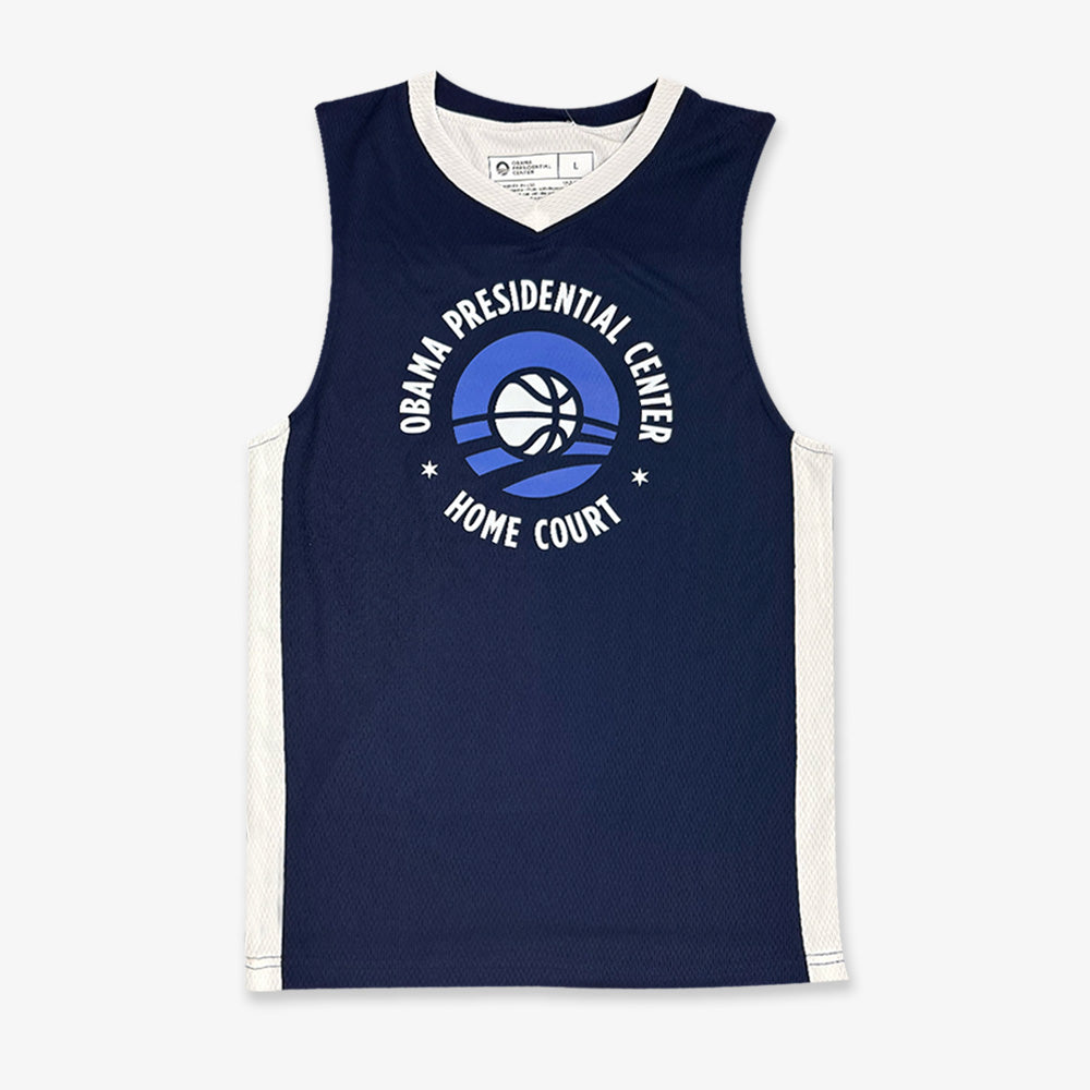The Obama Presidential Center Home Court Youth Jersey - Navy features white trim, a basketball graphic, and “Obama Presidential Center Home Court” text on the front. Part of the exclusive Home Court collection.
