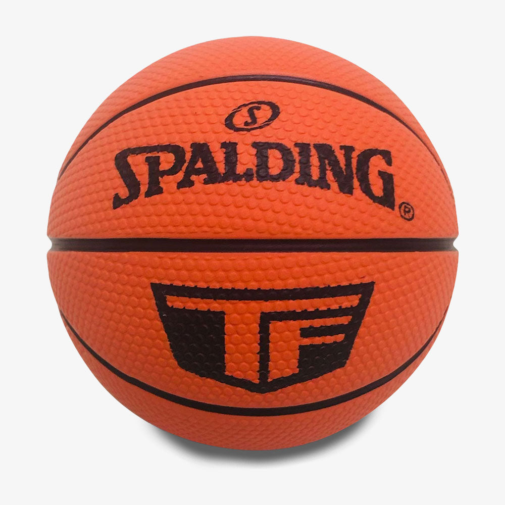 A Spalding Mini Basketball with a textured orange surface, black lines, the Spalding logo, and an extra black graphic beneath it is displayed against a white background.