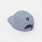 The Obama Presidential Center Hope Cap - Blue is displayed from the back, showing its adjustable metal buckle strap and a small navy embroidered logo above the opening.