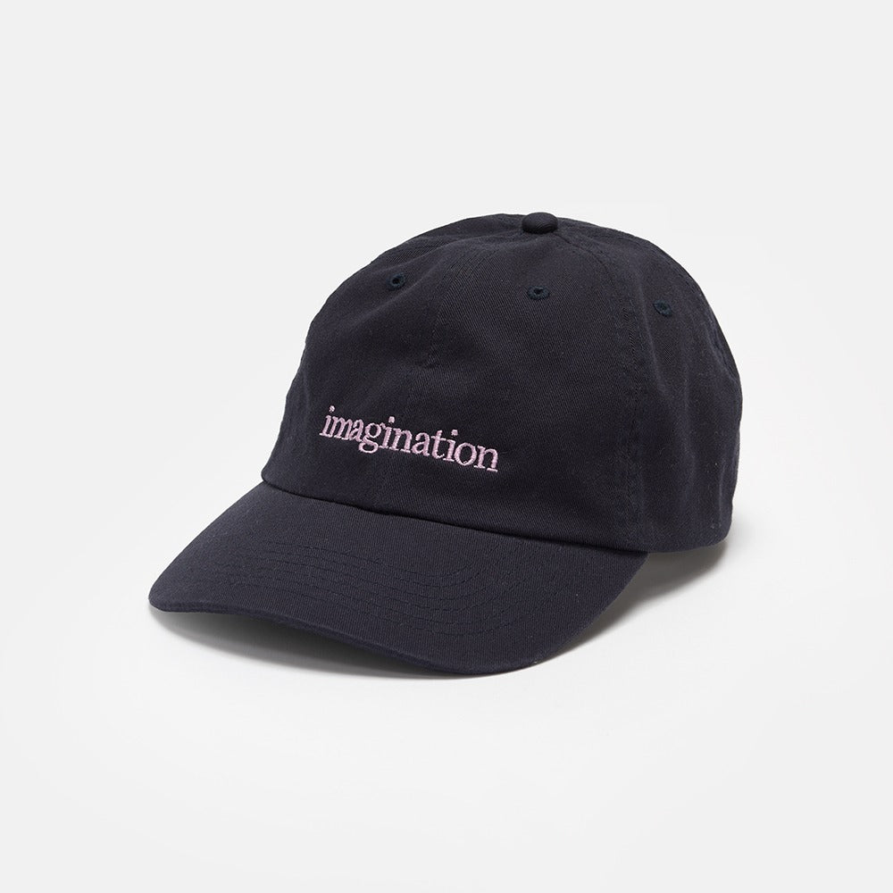 The Obama Presidential Center Imagination Cap is black with "imagination" embroidered in white on the front, shown against a plain white background.