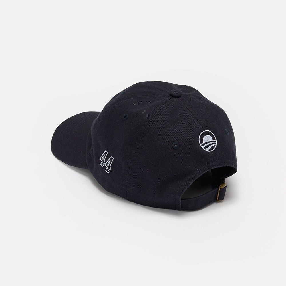 The Obama Presidential Center Embroidered Cap is black with "44" embroidered on the side and a white circular logo above the adjustable strap, shown on a white background.