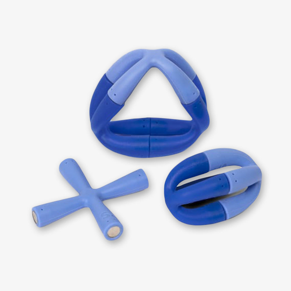 The Bluegrass Flex Set features three blue geometric pieces—a triangular ring, an oval ring, and an X-shaped cross—made from smooth, padded material for stress relief and creative play, displayed on a white background.