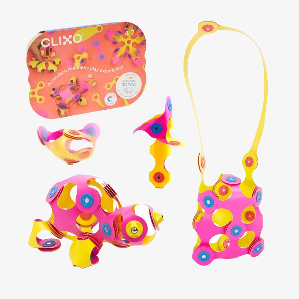Clixo Crew Pack, Pink/Yellow 30-piece magnetic building set, including the box and several colorful geometric structures built from this STEAM toy.