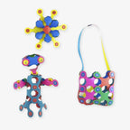 Three colorful Clixo Rainbow Pack craft projects: a star-shaped ornament, a small figurine, and a shoulder bag.
