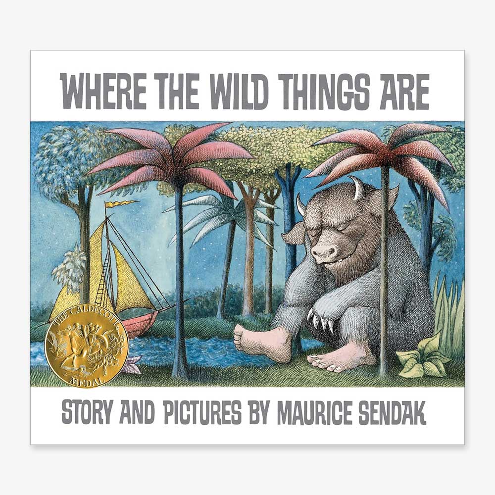 Book cover of Where the Wild Things Are, showing a boat on water near a large, furry horned creature under pink palm trees, with a gold medal on the left side.
