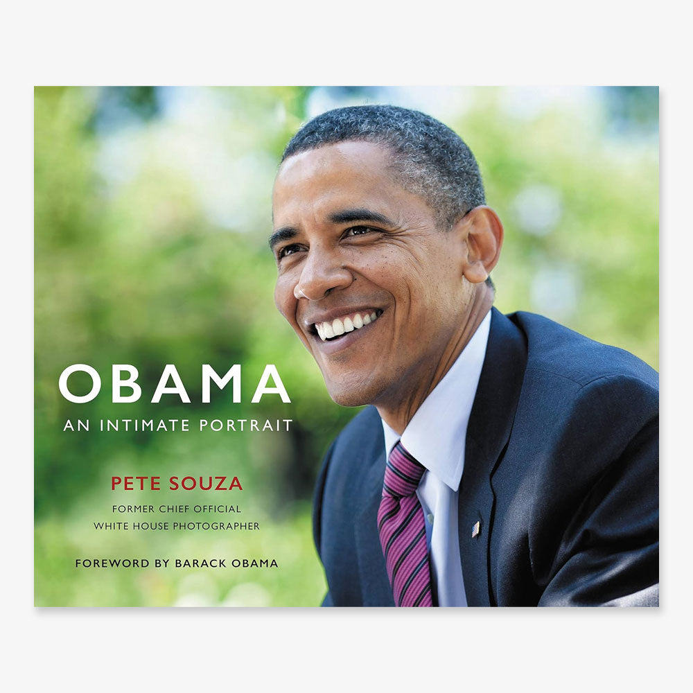 Book cover for "Obama: An Intimate Portrait" shows a smiling man in a suit and striped tie outdoors among greenery. Author Pete Souza is noted, with foreword by Barack Obama.