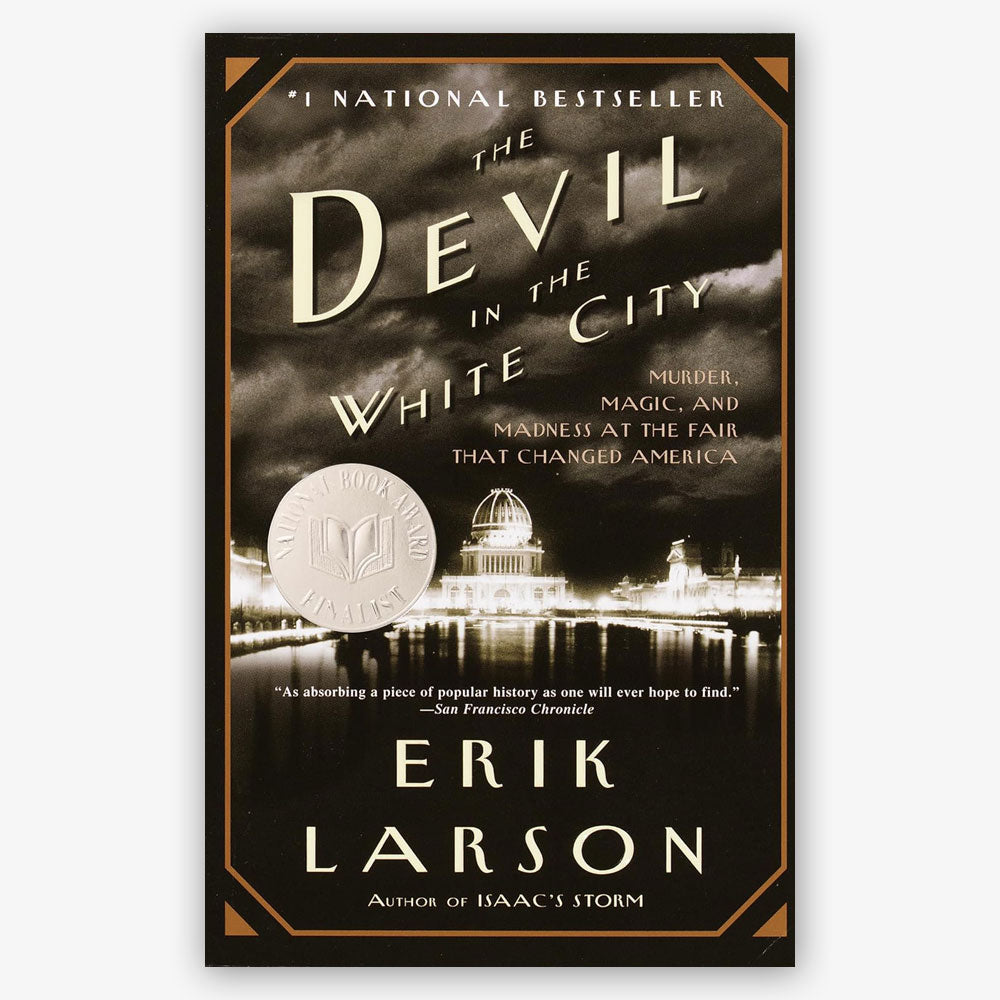 Book cover of "The Devil in the White City: Murder, Magic, and Madness at the Fair That Changed America," featuring a sepia night image of a domed building, award medallion, and striking white and gold text.
