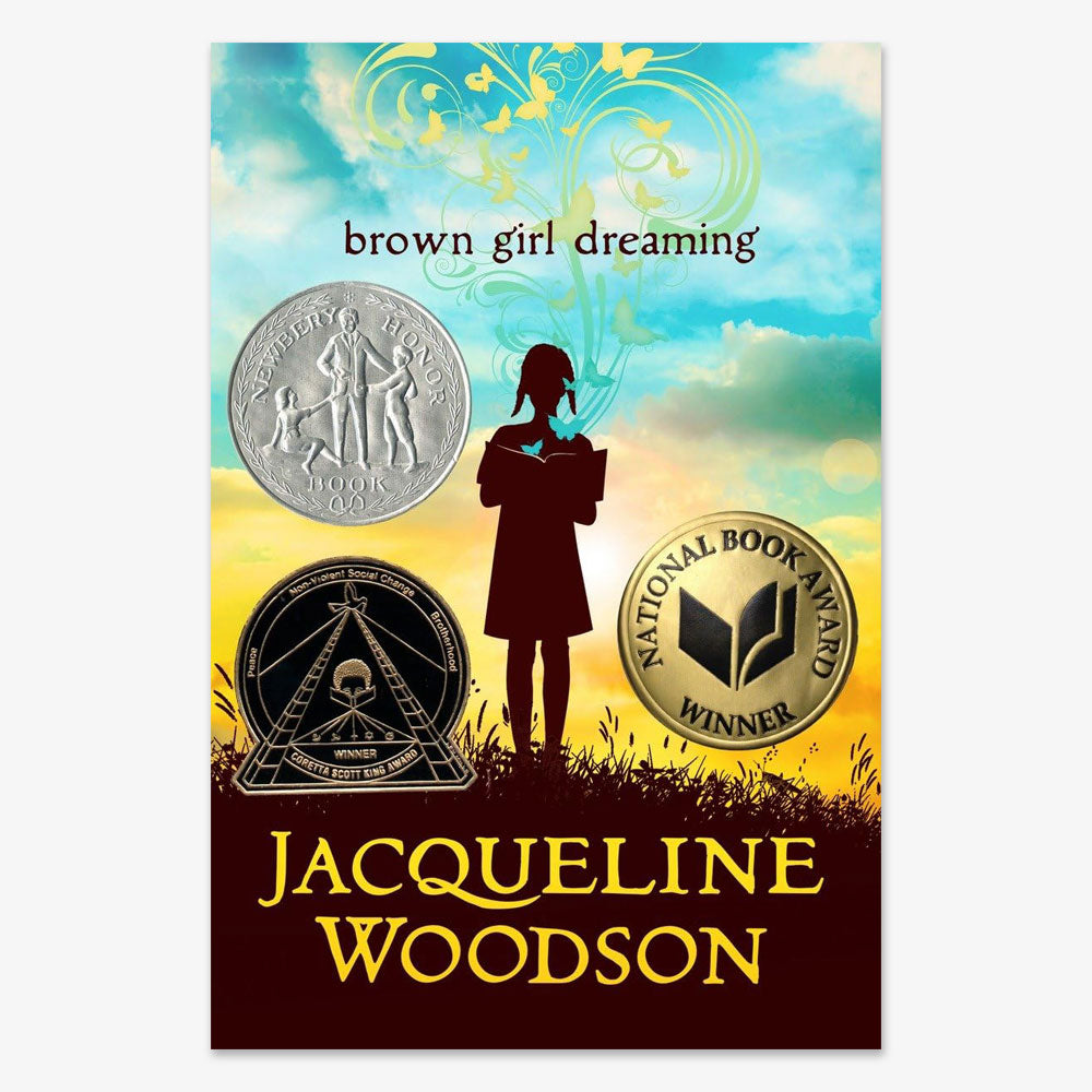 Book cover for Brown Girl Dreaming, a middle grade poetry novel by Jacqueline Woodson, shows a girl’s silhouette reading under colorful clouds and includes three medals: Newbery Honor, Coretta Scott King, and National Book Award Winner.
