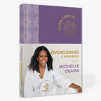 Michelle Obama smiles on the cover of Overcoming: A Workbook, her self-help workbook.