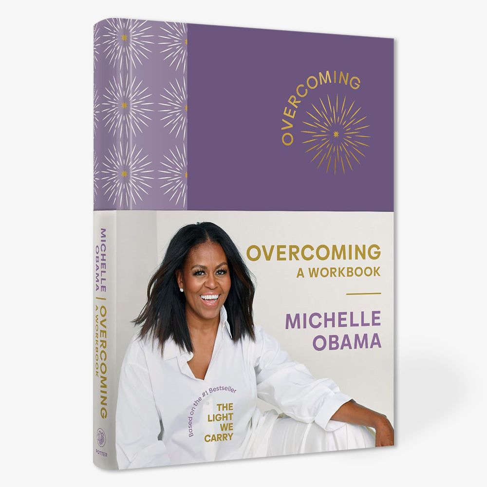 Michelle Obama smiles on the cover of Overcoming: A Workbook, her self-help workbook.