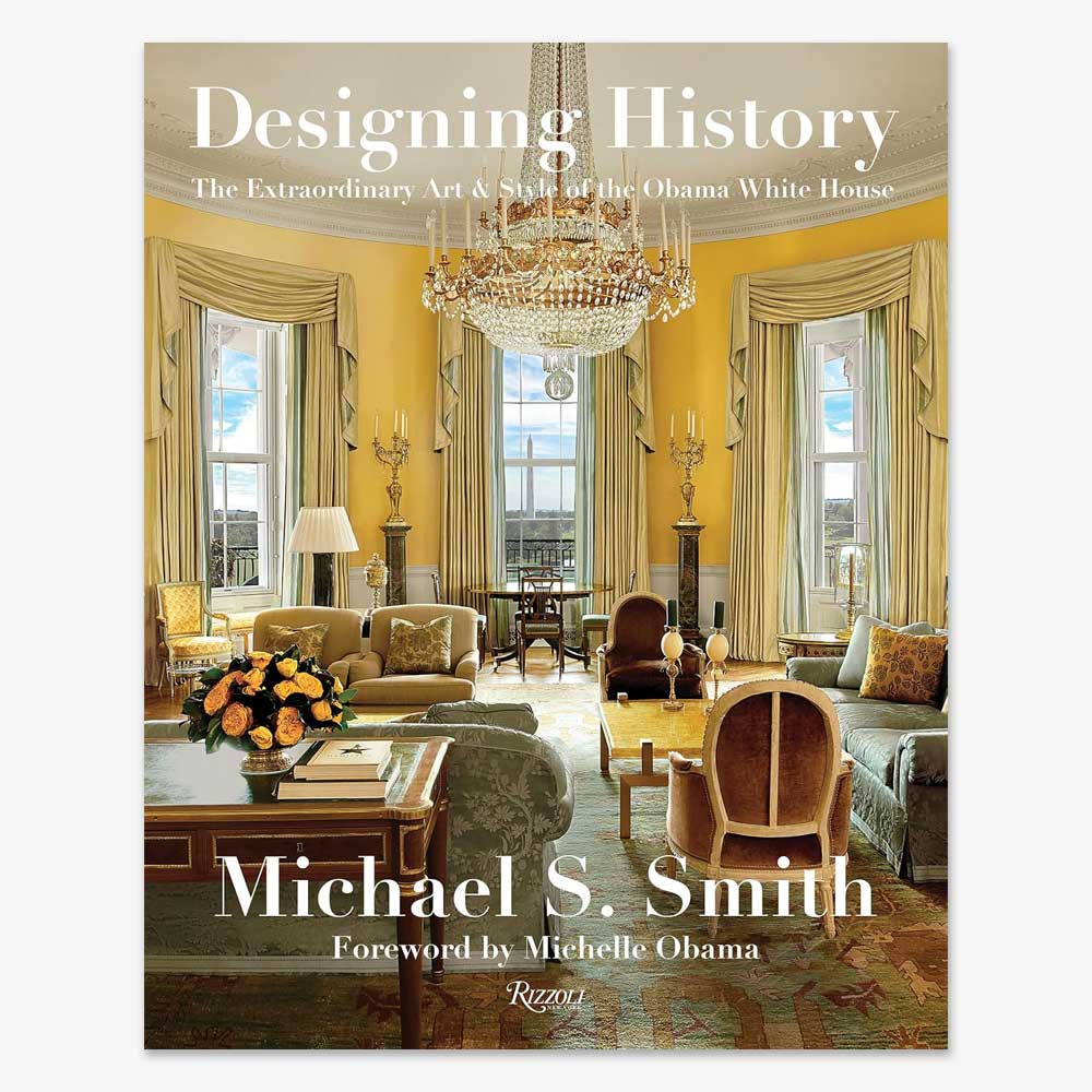 Book cover for Designing History: The Extraordinary Art and Style of the Obama White House, featuring the grand living room with gold curtains, plush chairs, and a striking chandelier.