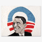 The Barack Obama Mini-Quilt Portrait Series features a mosaic-style portrait of Obama smiling with a blue and red circular background, ideal for postcards or handcrafted gifts. Faint handwritten text appears above on a textured white backdrop.