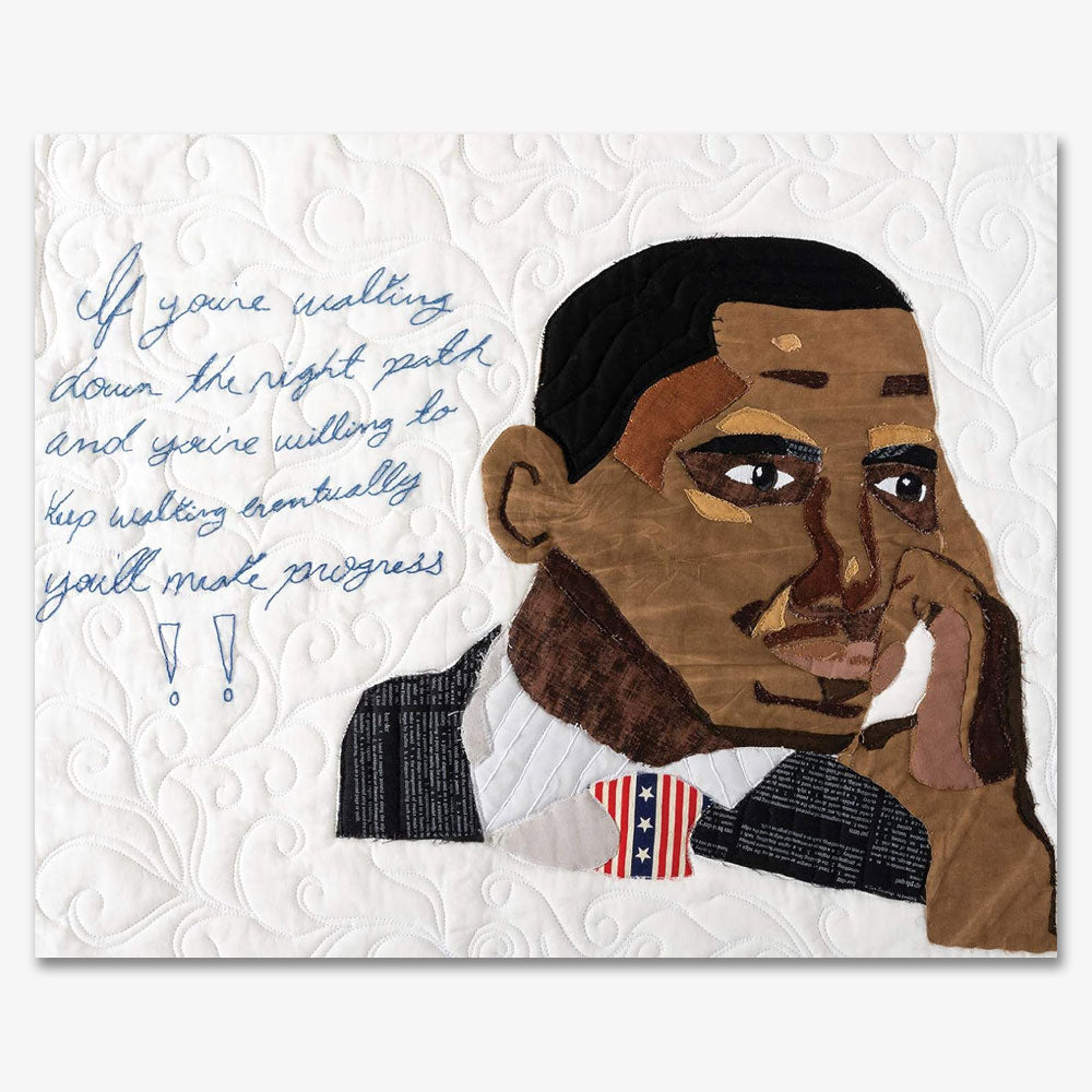 The Barack Obama Mini-Quilt Portrait Series features a quilted image of Obama in a suit and flag tie, resting his face on his hand, with the embroidered message: “If you’re walking down the right path… you’ll make progress!!”.