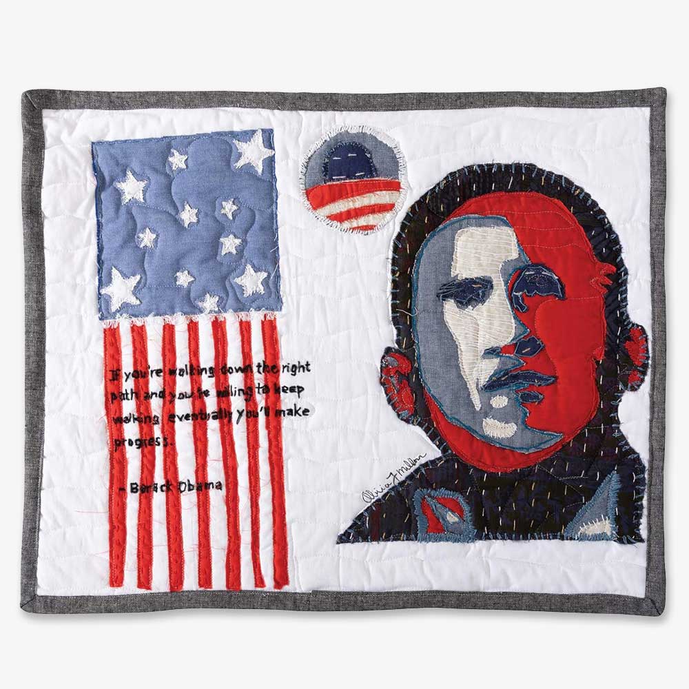 The Barack Obama Mini-Quilt Portrait Series features an abstract portrait in red, white, and blue with an American flag and the quote: "If you're walking down the right path...you'll make progress."—Barack Obama. Ideal for handmade gift lovers.