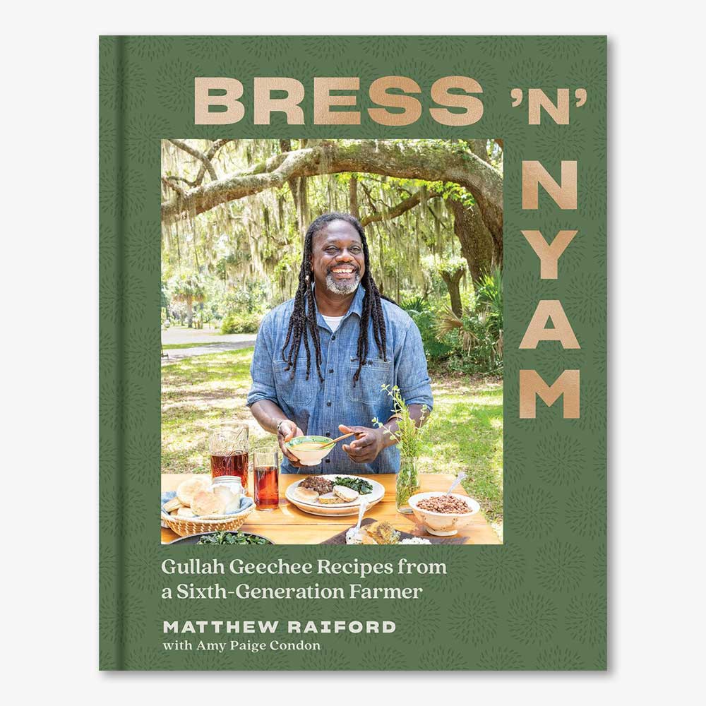 Cover of "Bress 'n' Nyam: Gullah Geechee Recipes from a Sixth-Generation Farmer," showing a smiling man with long hair serving food outdoors beneath mossy trees, with dishes and drinks arranged on a table before him.