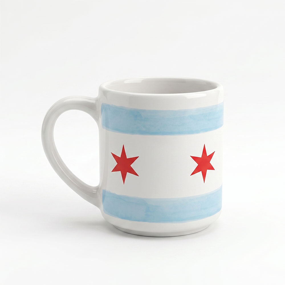 Show your Chicago pride with the Chicago Star Mug, a white porcelain mug decorated with blue stripes and red six-pointed stars inspired by the city flag—perfect for Windy City enthusiasts and Obama Foundation fans.