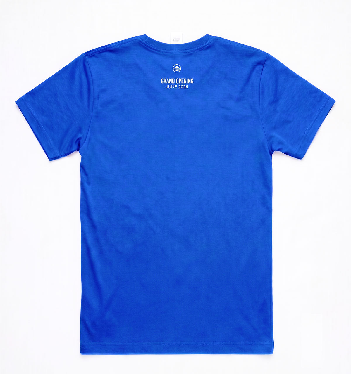 The Obama Presidential Center Logo T-Shirt - Royal Blue features "GRAND OPENING JUNE 2026" and a small white circular logo on the upper back near the collar, celebrating Chicago’s South Side. The shirt is plain with no other designs.