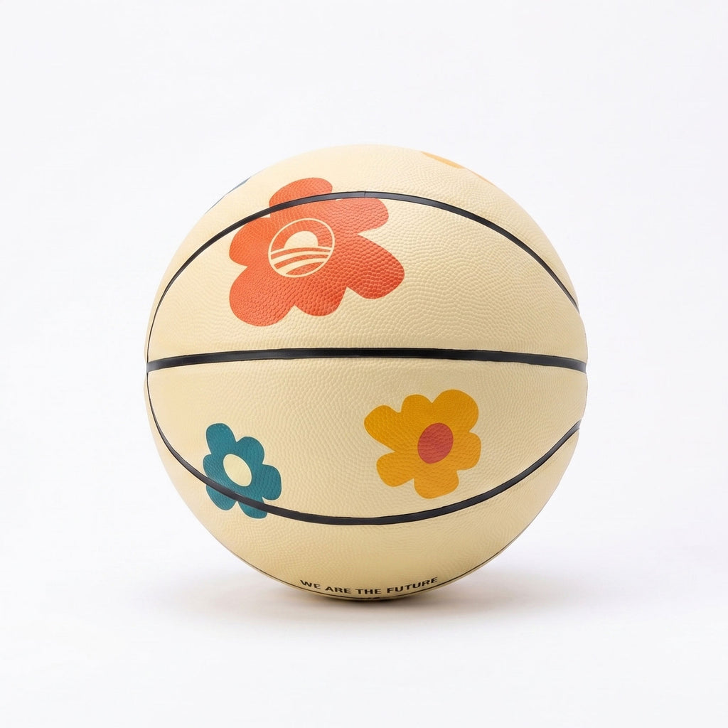 The Obama Presidential Center Floral Basketball features a cream base with red, orange, yellow, and blue flower designs and "We Are The Future" along the bottom edge. Part of the Home Court collection, it is photographed on a white background.